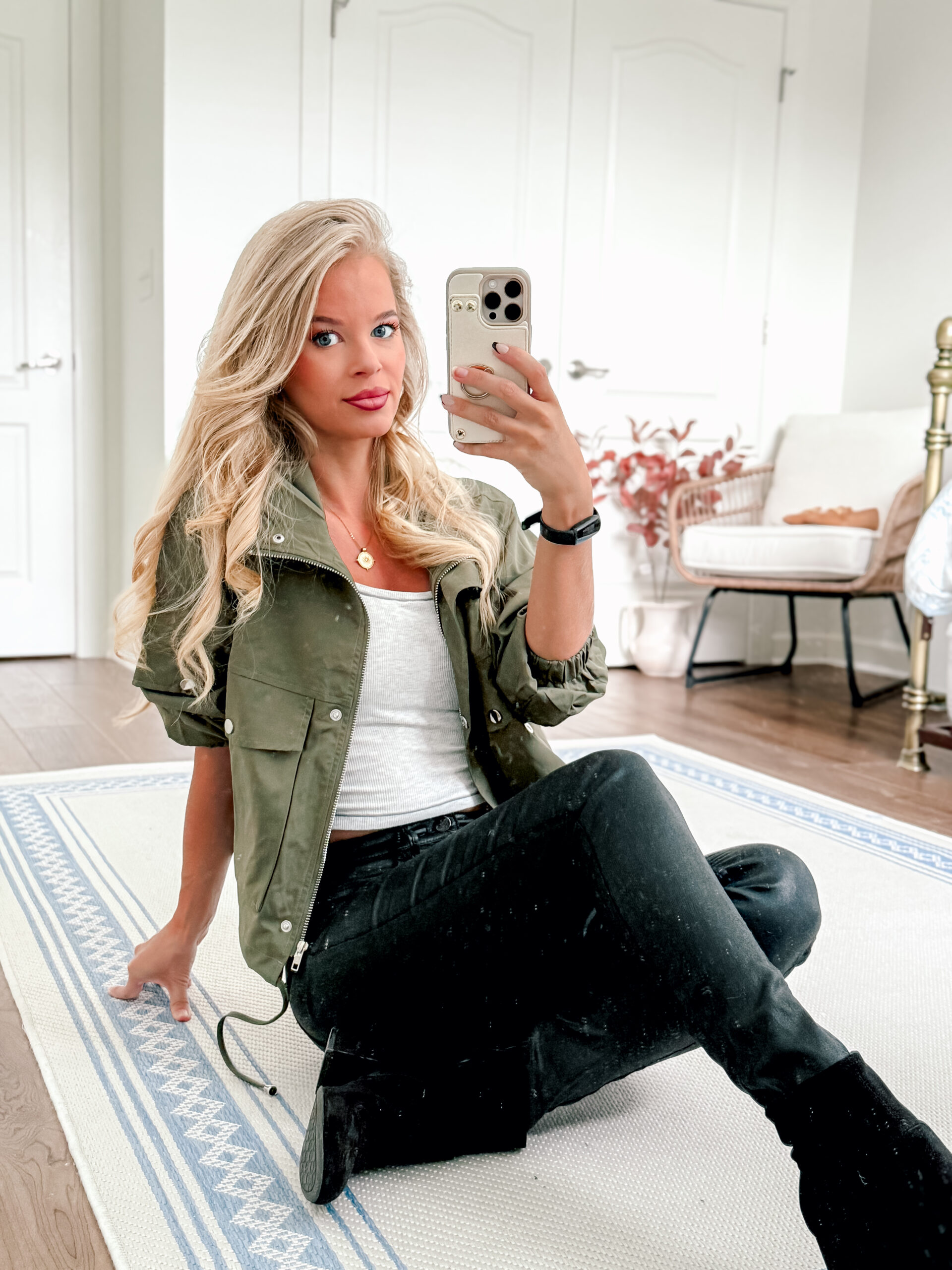 girl wearing green jacket with black leather pants